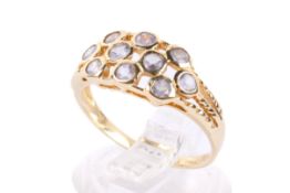 A yellow metal dress ring.