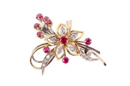 A diamond and ruby brooch.