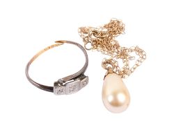 A vintage yellow metal ring and a boxed imitation pearl necklace.