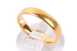 A 22ct gold wedding band. Hallmarked, size L, weight 3.7g.