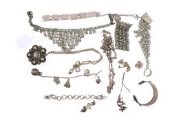 A collection of white metal filigree jewellery.