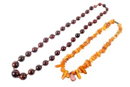 Two amber necklaces. The first with irregular butterscotch chips, L46cm, weight 49.