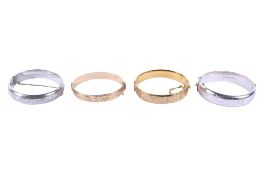 Two silver bangles and a two 9ct rolled gold examples.