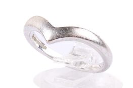 An 18ct white gold ring. Of V-shape, undecorated, hallmarked, size L, weight 3.7g.