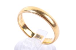 A 22ct gold wedding band. Hallmarked, size P1/2, weight 5.8g.
