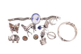An assortment of silver and white metal jewellery. Comprising an engraved silver bangle, 22.