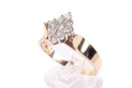 A yellow metal and diamond dress ring.