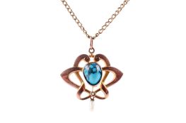 An Edwardian open scrollwork pendant.