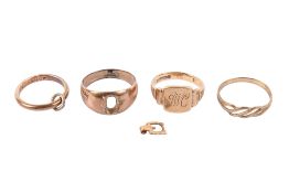 Four 9ct gold and yellow metal rings.