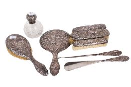 A small group of early 20th century silver mounted dressing table items.