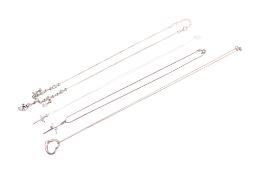 Four silver and white metal necklaces.