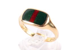 An 18ct gold ring. With green and red enamel panel, engraved beneath 'For remembrance 4.6.
