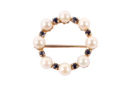 A 9ct gold, pearl and blue stone wreath brooch.