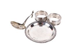 Four silver and white metal objects.