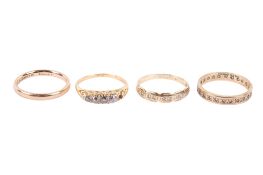 Four 9ct gold rings.