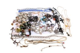 A collection of costume jewellery in a mahogany box.