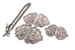 Three Indian white metal belt buckles and a Victorian silver pocket watch chain.