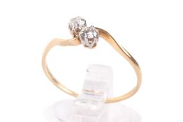 A yellow metal and diamond ring.