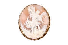 An oval shell cameo brooch depicting a winged figure in battle. Overall dimensions 53mm x 48mm.