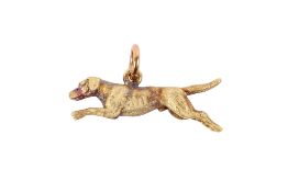A 9ct gold charm. In the form of a running dog, hallmarked to the body, W3.2cm weight 5.8g.