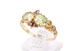 A yellow metal peridot ring.