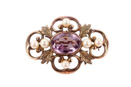 A yellow metal, pearl and amethyst brooch.