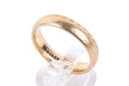 A 9ct gold ring. With slightly rubbed banded decoration, hallmarked, size S/T, weight 5.4g.