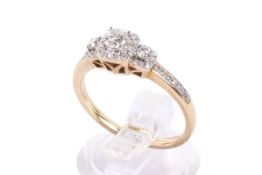 A hallmarked 9ct gold diamond ring. Set with round brilliant cut diamonds of stated weight 0.