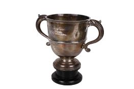 An early 20th century silver 'Ploughing & Hedging Association' trophy.