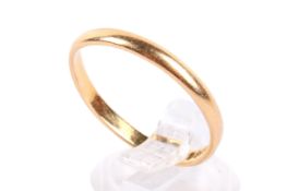 A 22ct gold wedding band. Hallmarked, distorted form, weight 3.