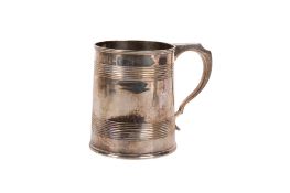 A Victorian silver mug.