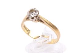 An 18ct gold and diamond solitaire ring. Set with one round brilliant cut diamond of 0.