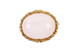 An oval hardstone brooch.