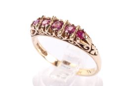 A 9ct gold and ruby ring. With five small graduated stones, hallmarked, size O1/2, gross weight 2.