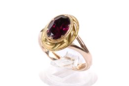 A 9ct gold and garnet ring.