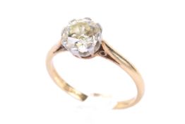 A yellow metal diamond solitaire ring. The brilliant cut diamond estimated circa 1.