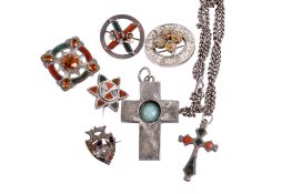 A group of silver and white metal stone set brooches and two pendants.