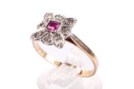 An 18ct gold and platinum ring. Set with one cushion set pink sapphire of 0.