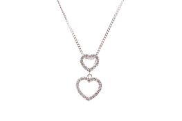 A gold and white stone double heart pendant on a 9ct white gold chain.