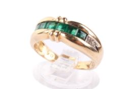 An 18ct gold and emerald ring.