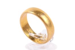 A 22ct gold wedding band. Hallmarked, size T, weight 10.4g.