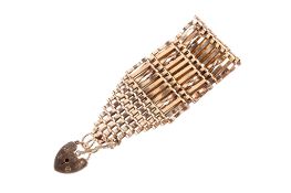A 9ct gold gate link bracelet. With heart locket, hallmarked, width 3.
