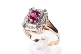 A 9ct gold, diamond and garnet dress ring.