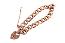 A rose coloured metal curb link bracelet with heart padlock.