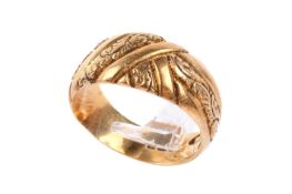 An 18ct gold ring. With banded textured design, hallmarked, size L, weight 6.5g.