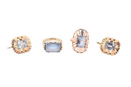 A pair of topaz earrings and matching ring and another similar ring.