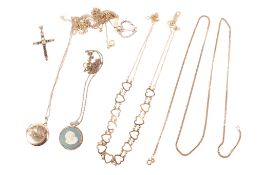 A group of thin gold and yellow metal chains.