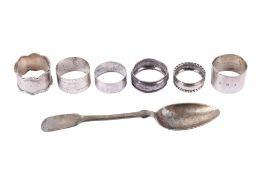 A quantity of silver hallmarked items. Including six napkin rings and a spoon. (7).