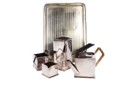 An Art Deco silverplated four-piece Bachelor tea service and a tray.