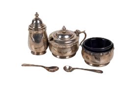 A George V silver condiment set.
